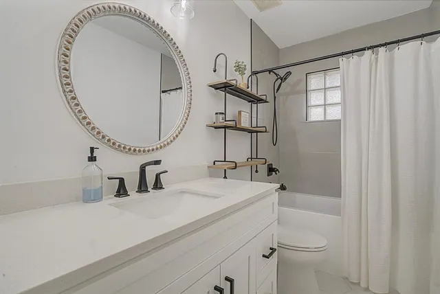 a bedroom with furniture and baby crib