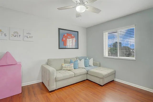 a view of a backyard with a garden and furniture