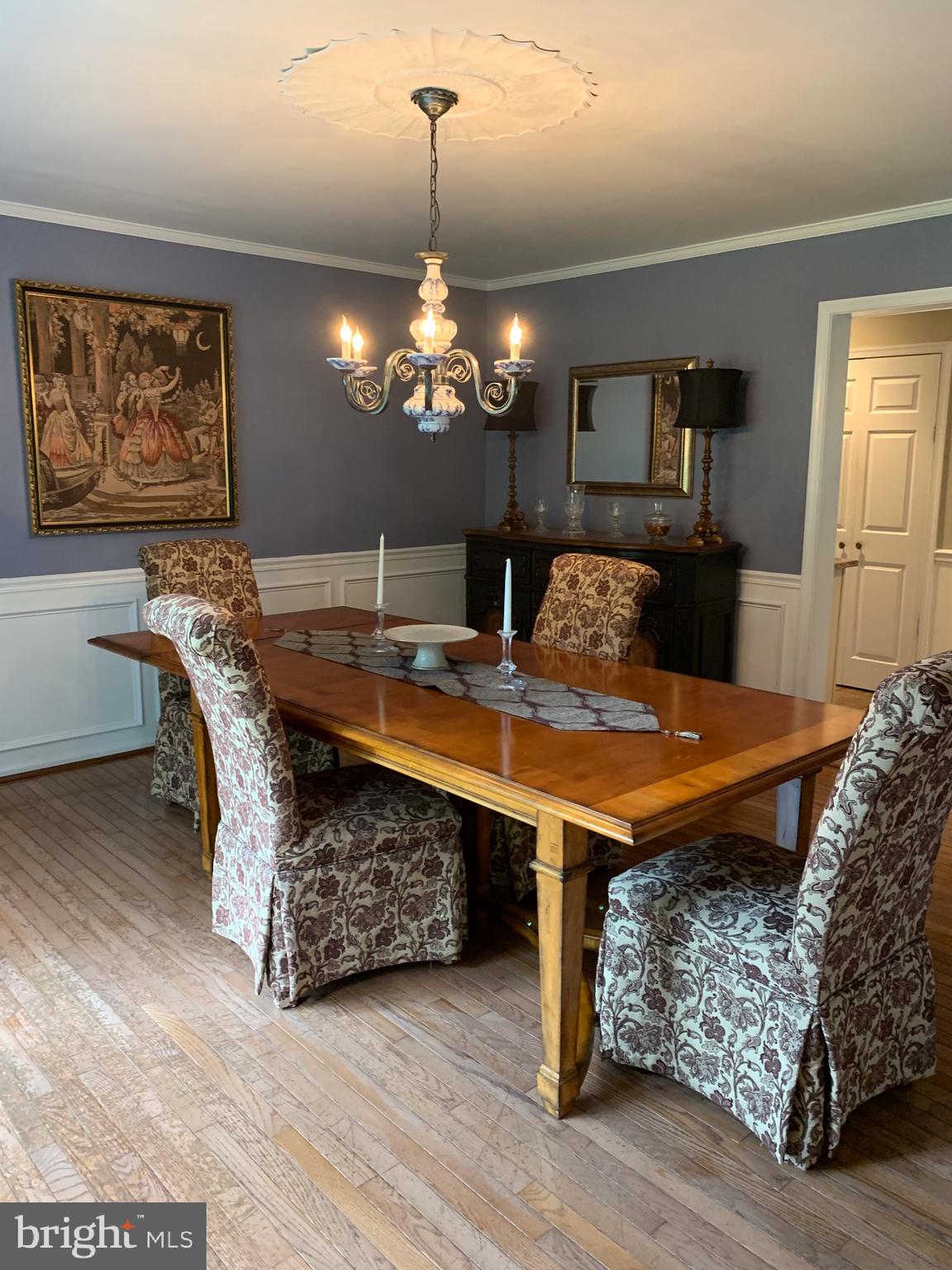 1292 Heller Drive Yardley, PA 19067 - Photo 11 of 36 a dining room with wooden floor a chandelier a wooden table and chairs