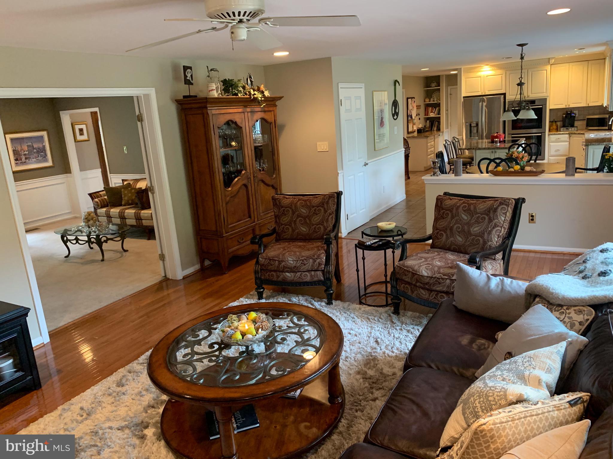 1292 Heller Drive Yardley, PA 19067 - Photo 15 of 36 a living room with furniture and a chandelier
