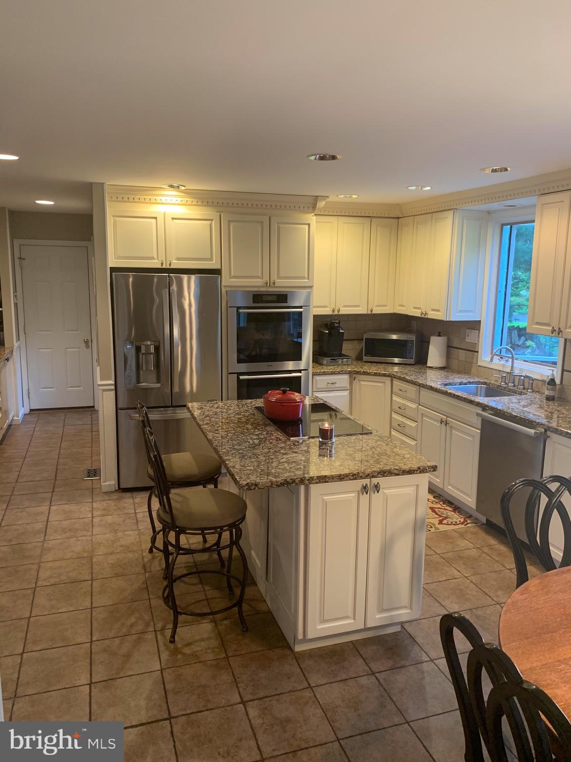 1292 Heller Drive Yardley, PA 19067 - Photo 16 of 36 a kitchen with a sink a counter top space appliances and cabinets