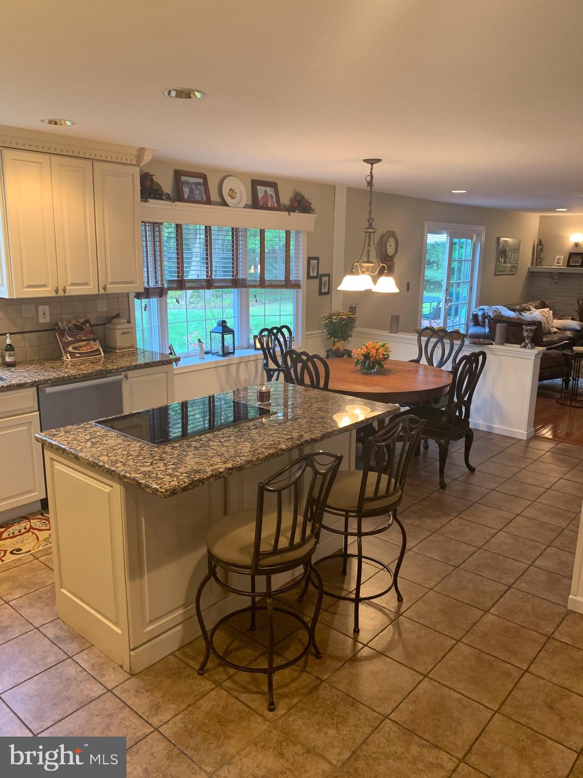 1292 Heller Drive Yardley, PA 19067 - Photo 17 of 36 a dining hall with granite countertop a dining table and chairs