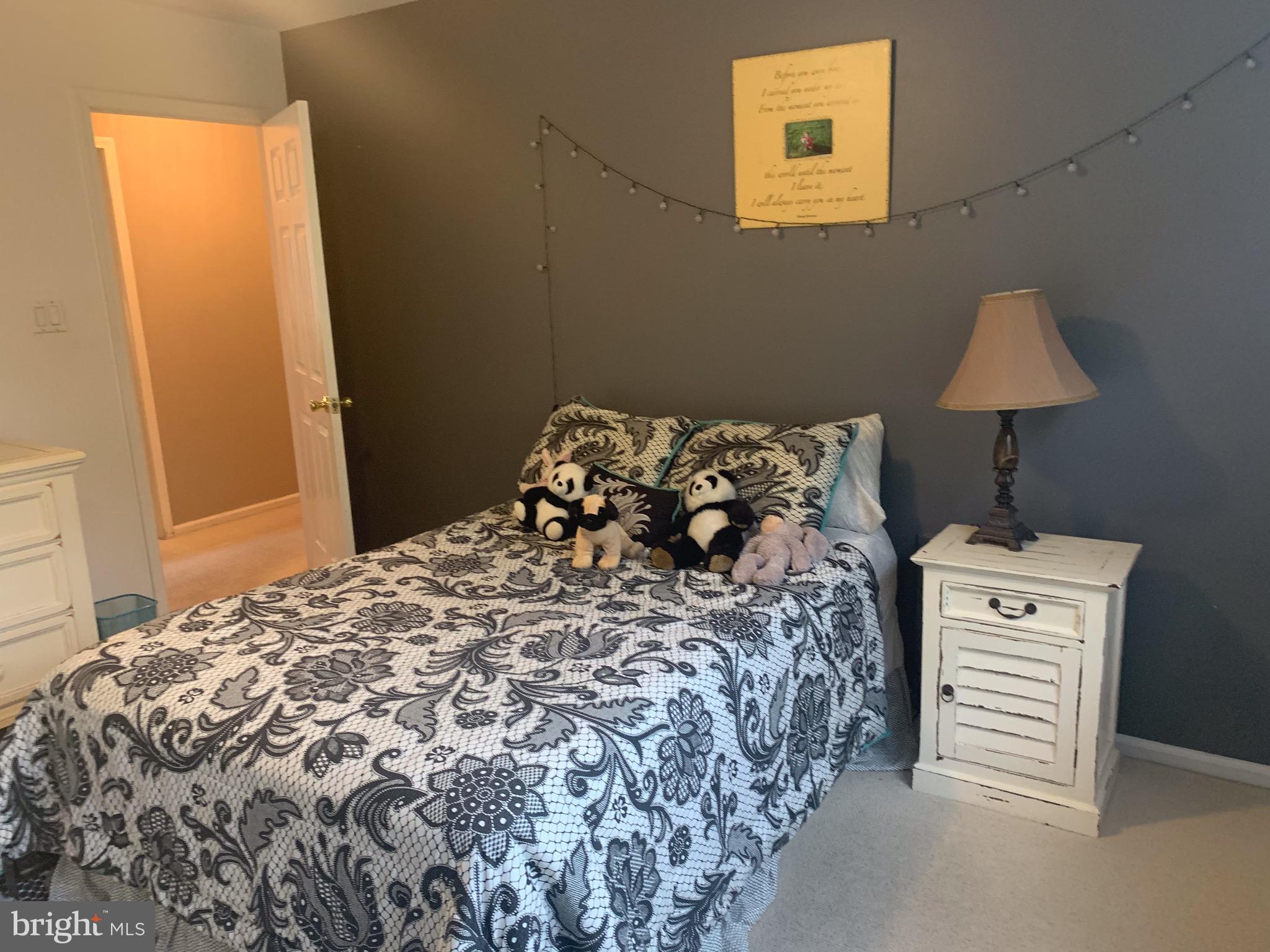 1292 Heller Drive Yardley, PA 19067 - Photo 29 of 36 a bed sitting in a bedroom next to a window