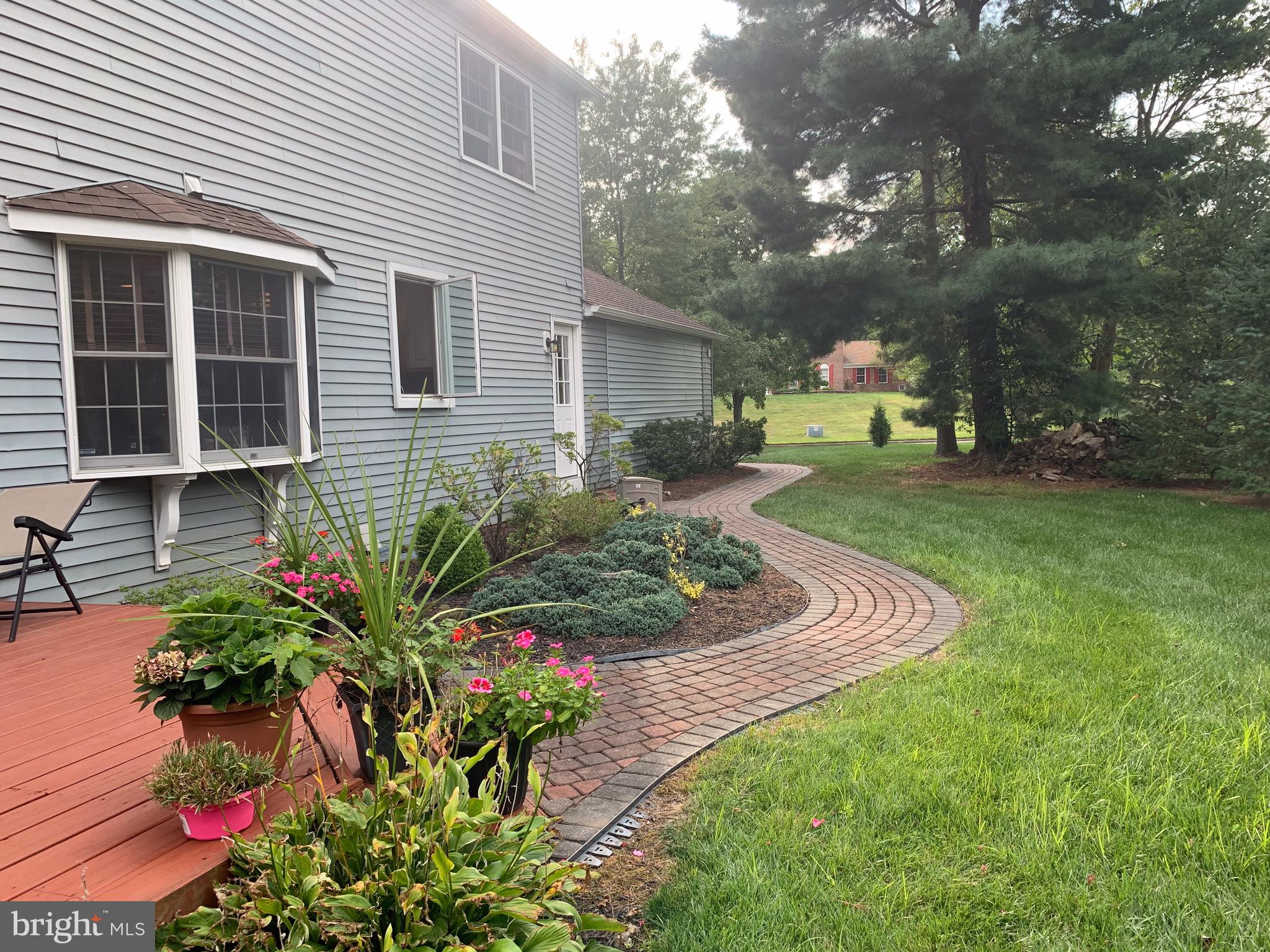 1292 Heller Drive Yardley, PA 19067 - Photo 5 of 36 a front view of a house with garden