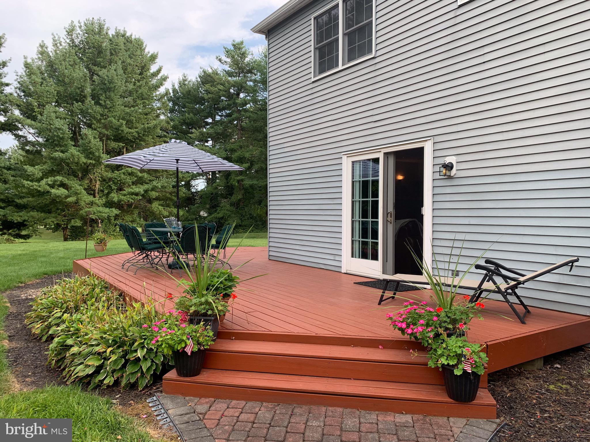 1292 Heller Drive Yardley, PA 19067 - Photo 6 of 36 a front view of a house with a yard and a garden