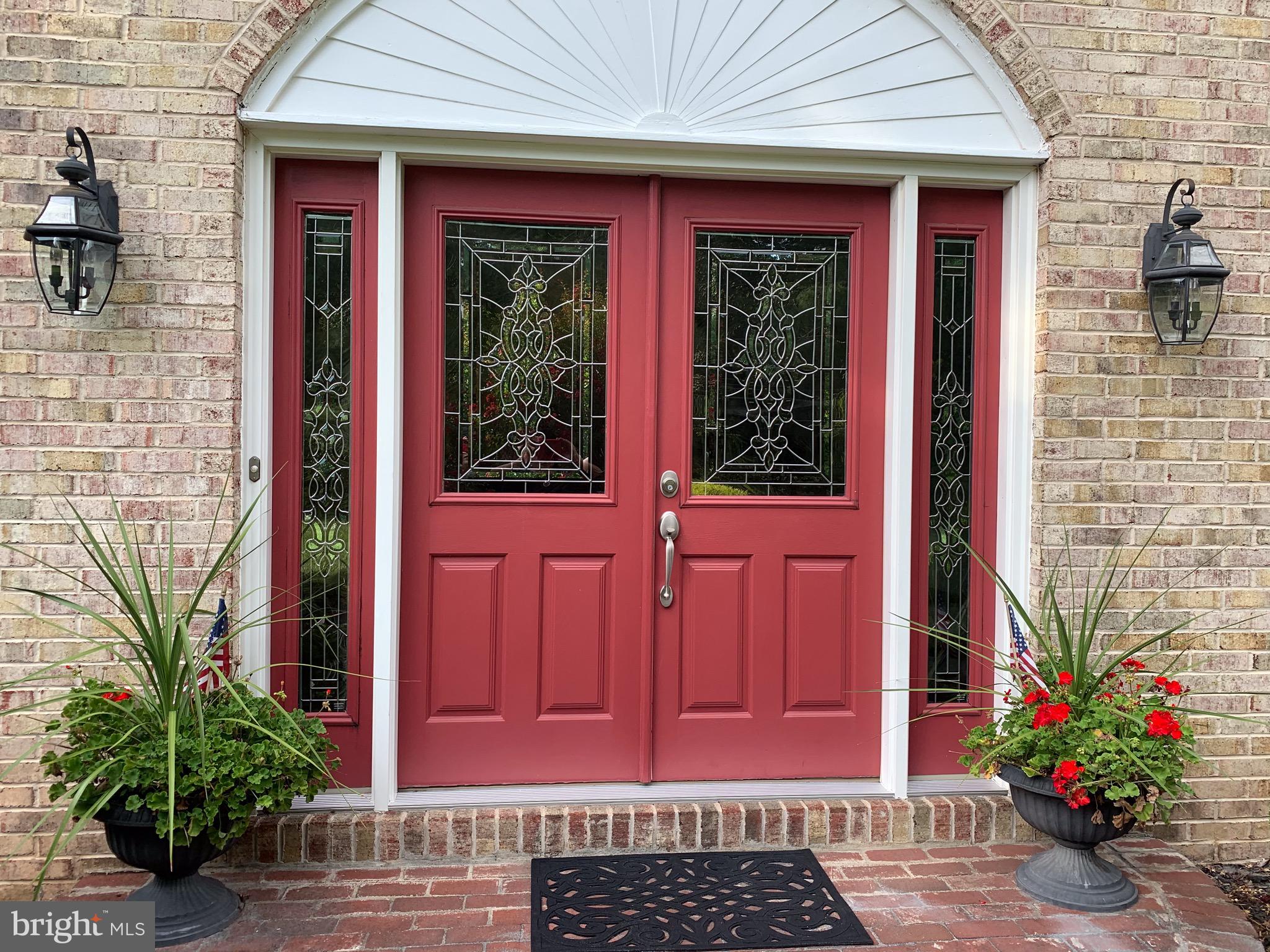 1292 Heller Drive Yardley, PA 19067 - Photo 7 of 36 a view of a house with red door and a chair