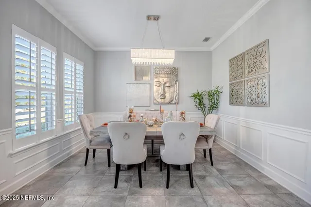 a large bedroom with a bed and a flat screen tv