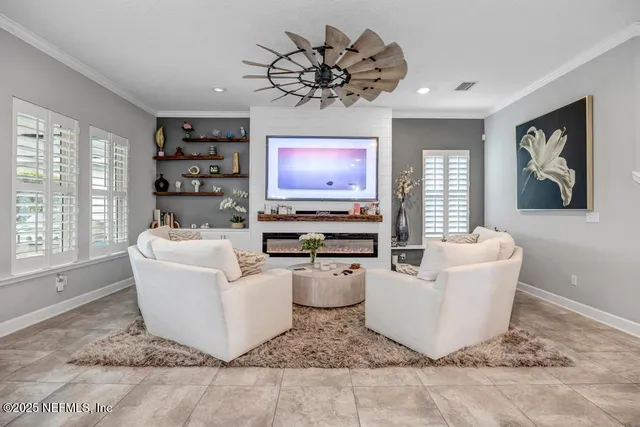 a view of walk in closet with clothes