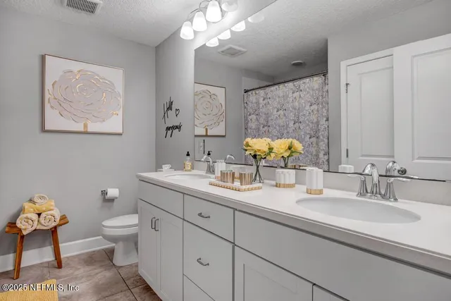 a view of a patio with table and chairs under an umbrella