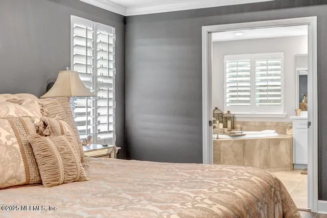 a front view of a house with a garden and trees