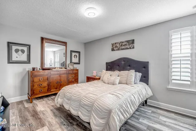 an aerial view of a house with yard swimming pool and outdoor seating