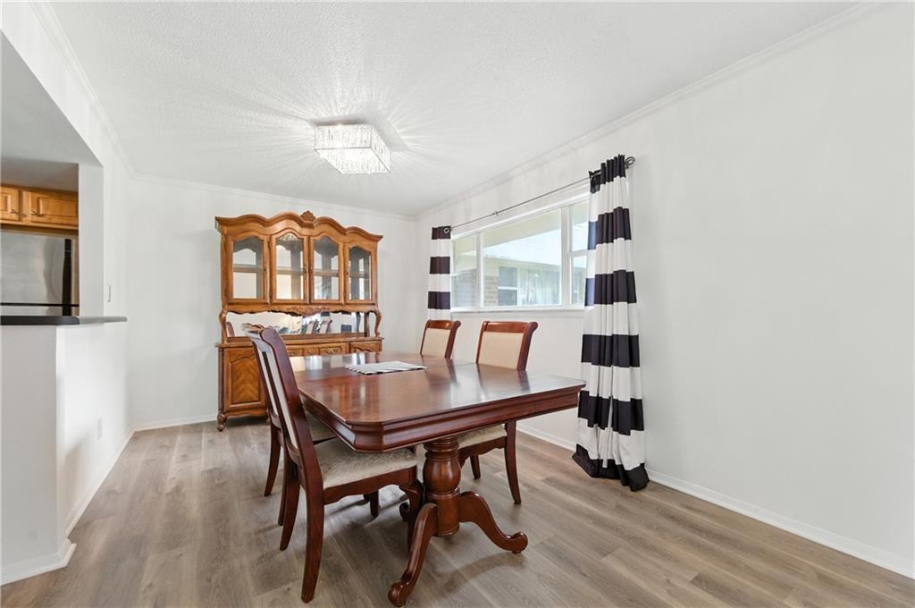 3301 Henderson Mill Road, Unit AA3 Atlanta, GA 30341 - Photo 11 of 32 a dining room with furniture and window