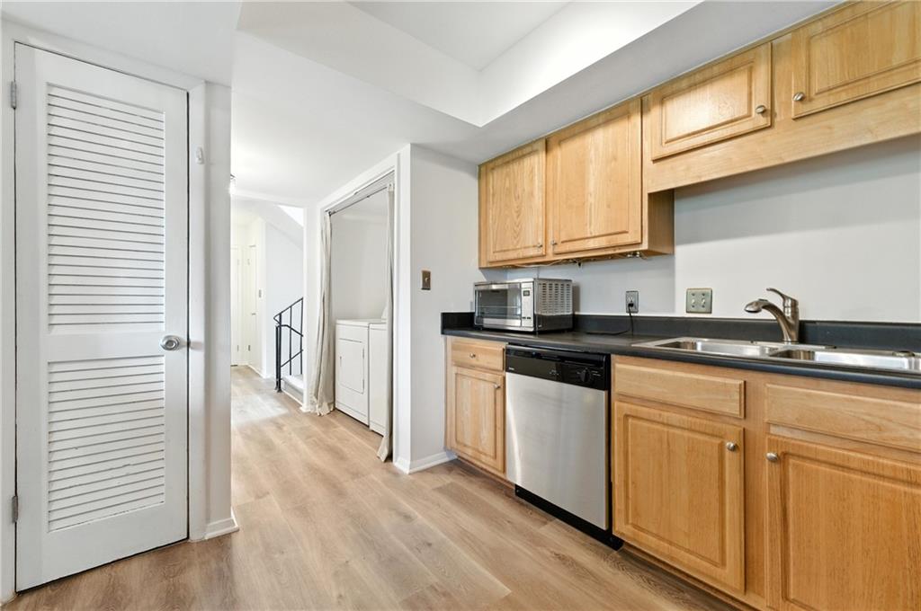 3301 Henderson Mill Road, Unit AA3 Atlanta, GA 30341 - Photo 14 of 32 a kitchen with stainless steel appliances granite countertop a refrigerator and a sink