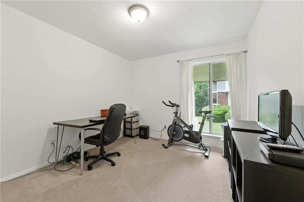 3301 Henderson Mill Road, Unit AA3 Atlanta, GA 30341 - Photo 19 of 32 a view of a workspace with furniture and a window