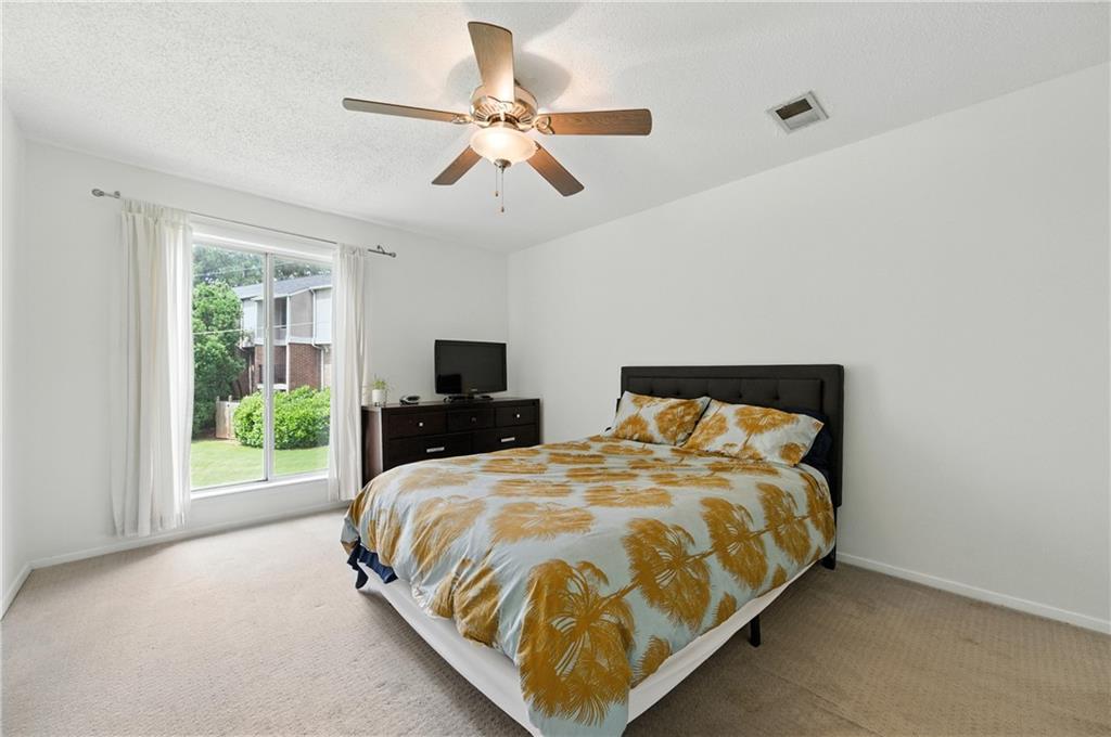 3301 Henderson Mill Road, Unit AA3 Atlanta, GA 30341 - Photo 22 of 32 a bedroom with a bed and window