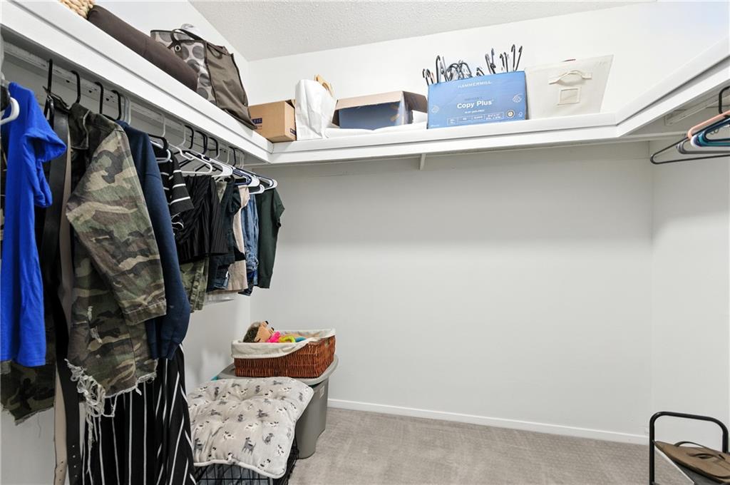 3301 Henderson Mill Road, Unit AA3 Atlanta, GA 30341 - Photo 24 of 32 a view of walk in closet with clothes and shoes
