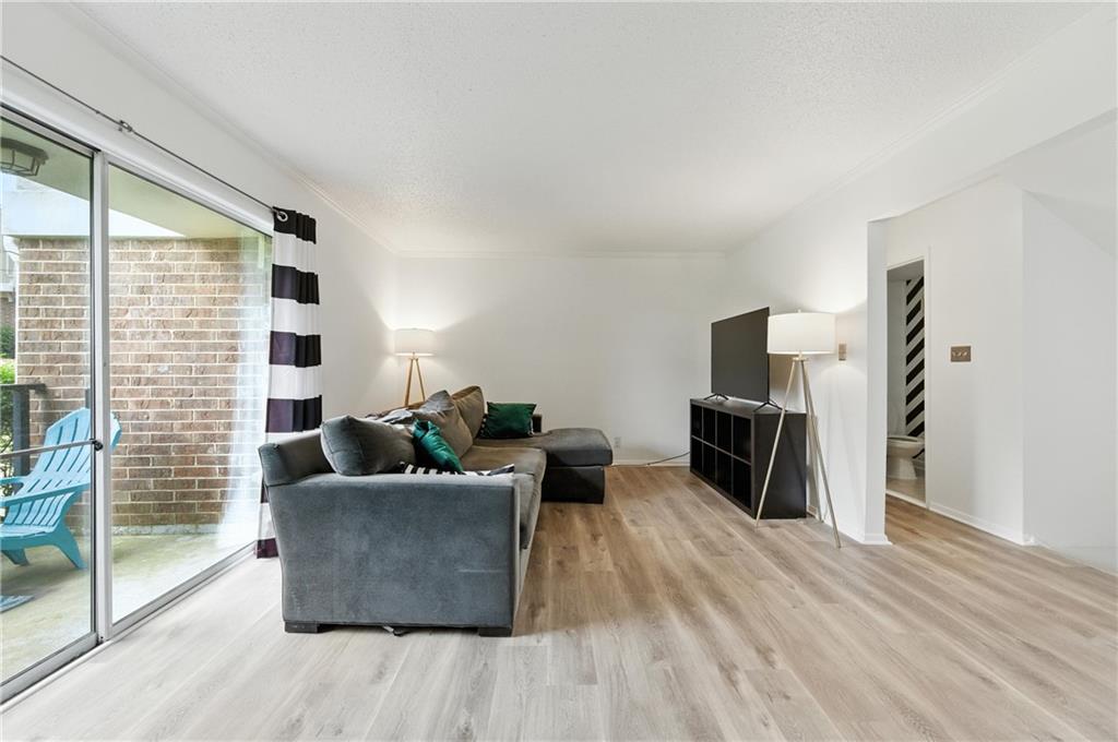 3301 Henderson Mill Road, Unit AA3 Atlanta, GA 30341 - Photo 6 of 32 a living room with furniture and a flat screen tv