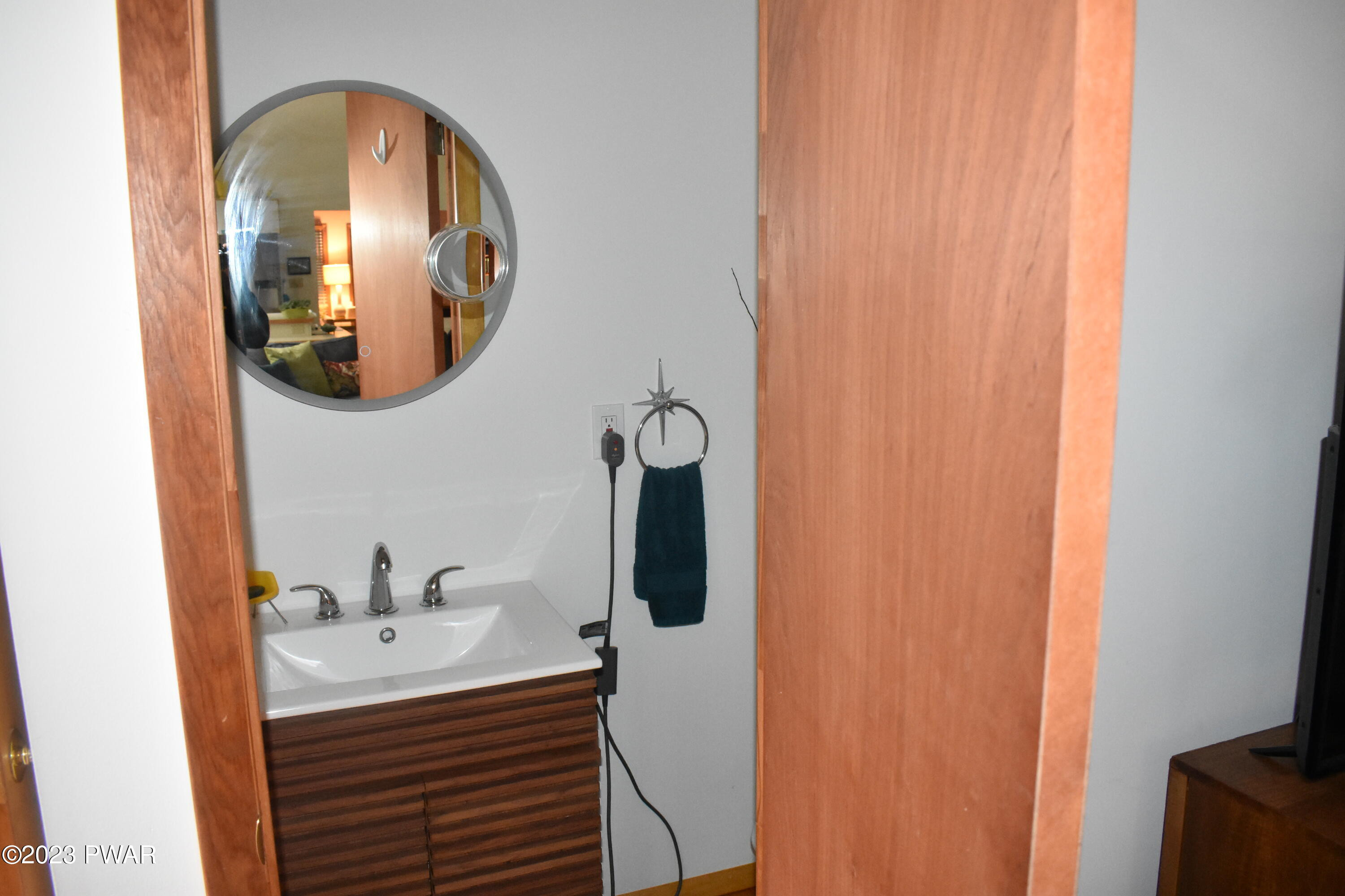 139 Rodeo Drive Hawley, PA 18428 - Photo 23 of 27 a bathroom with a sink and a mirror