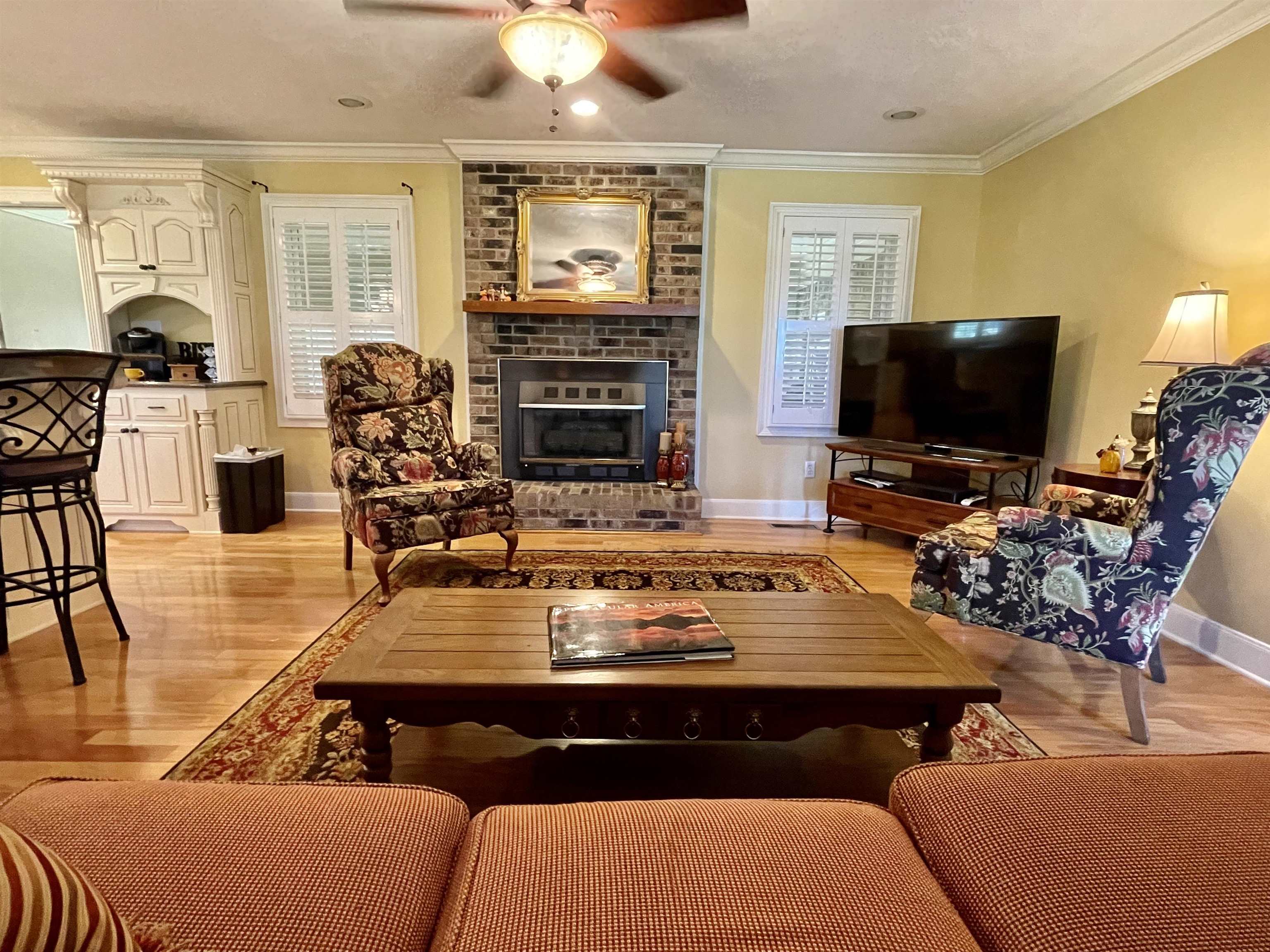 926 57th Highway Ramer, TN 38367 - Photo 10 of 25 a living room with furniture a flat screen tv and kitchen view