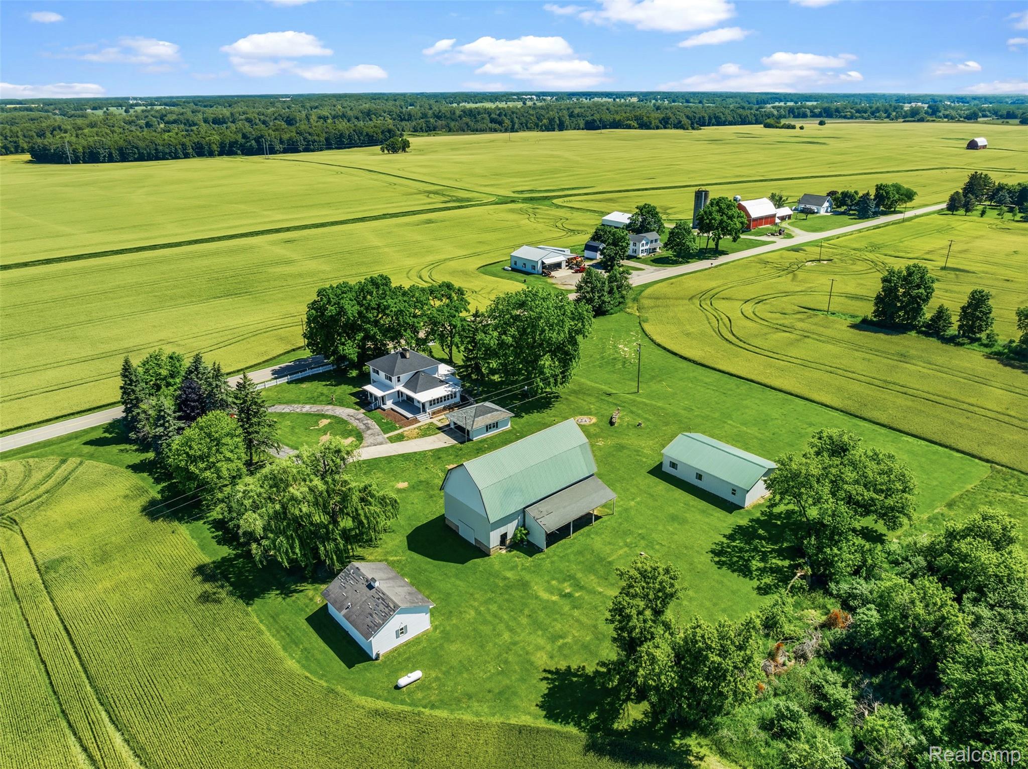 5843 West Dewey Road Owosso, MI 48867 - Photo 57 of 58 Expansive rural property featuring a main residence, multiple outbuildings, and cultivated fields