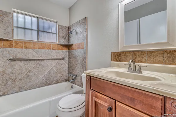 a bathroom with a sink a toilet and a bathtub