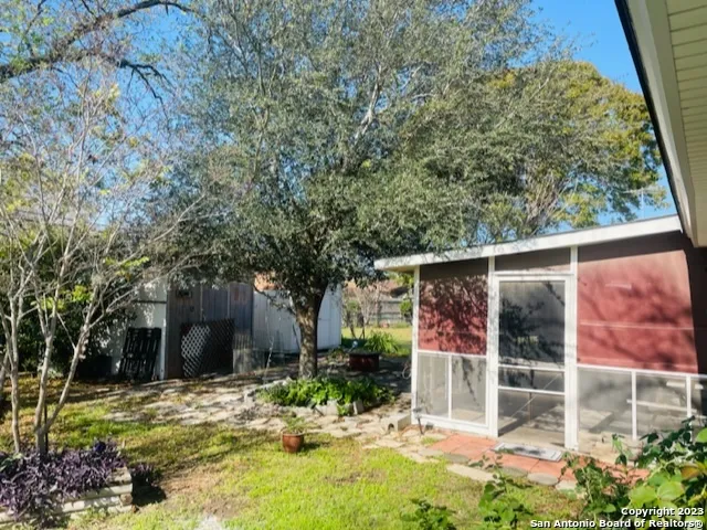 front view of a house with a tree