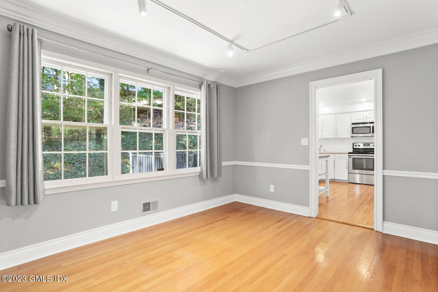 6 Pintail Lane Greenwich, CT 06830 - Photo 12 of 41 a view of an empty room with a window and wooden floor