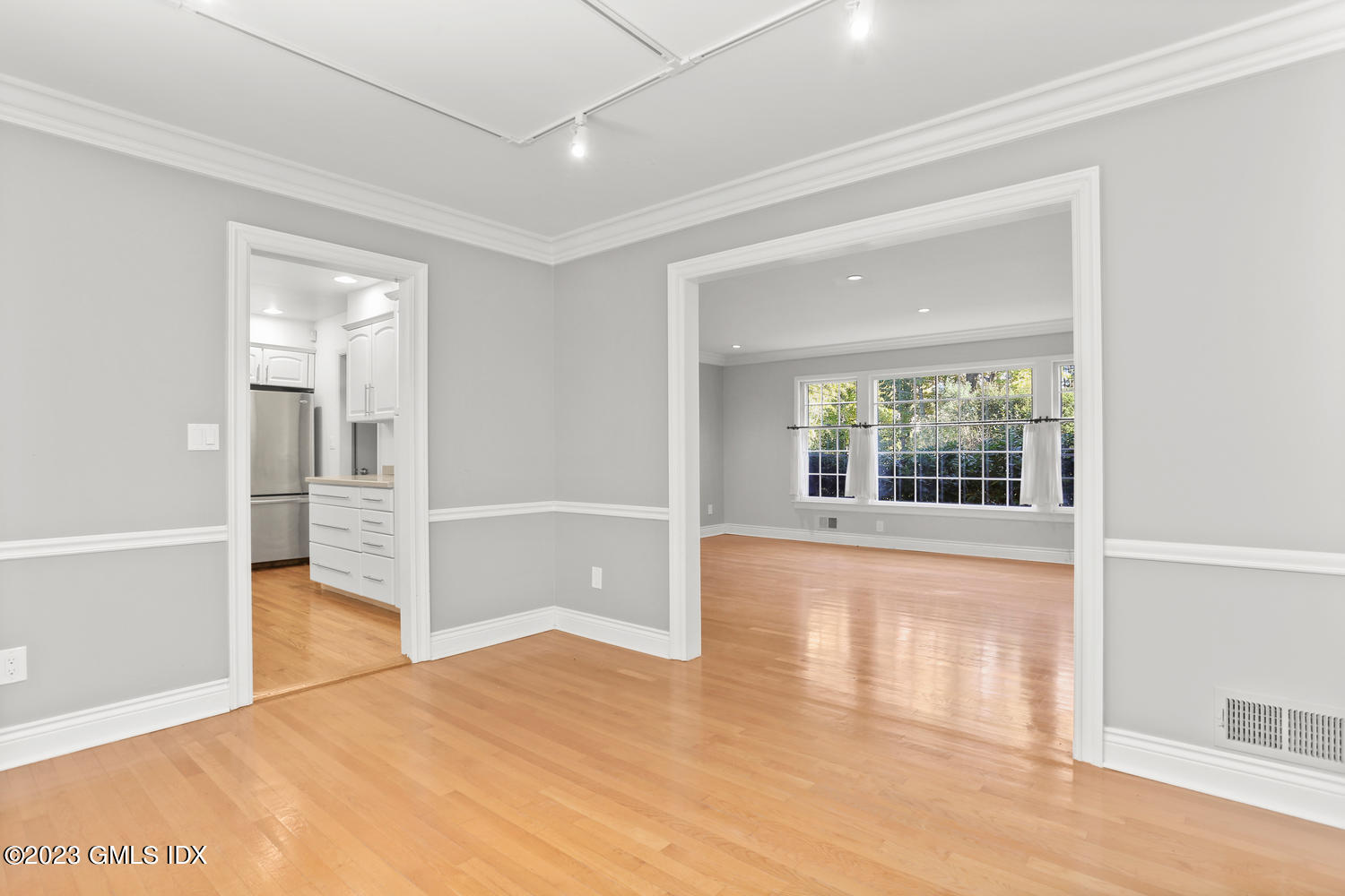 6 Pintail Lane Greenwich, CT 06830 - Photo 13 of 41 an empty room with wooden floor and windows