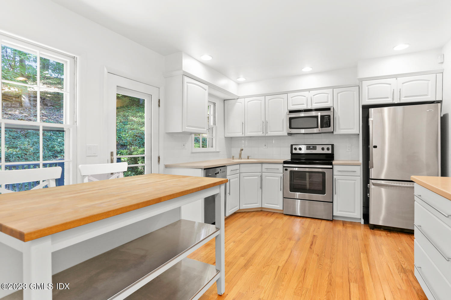 6 Pintail Lane Greenwich, CT 06830 - Photo 15 of 41 a kitchen with stainless steel appliances a refrigerator sink and microwave