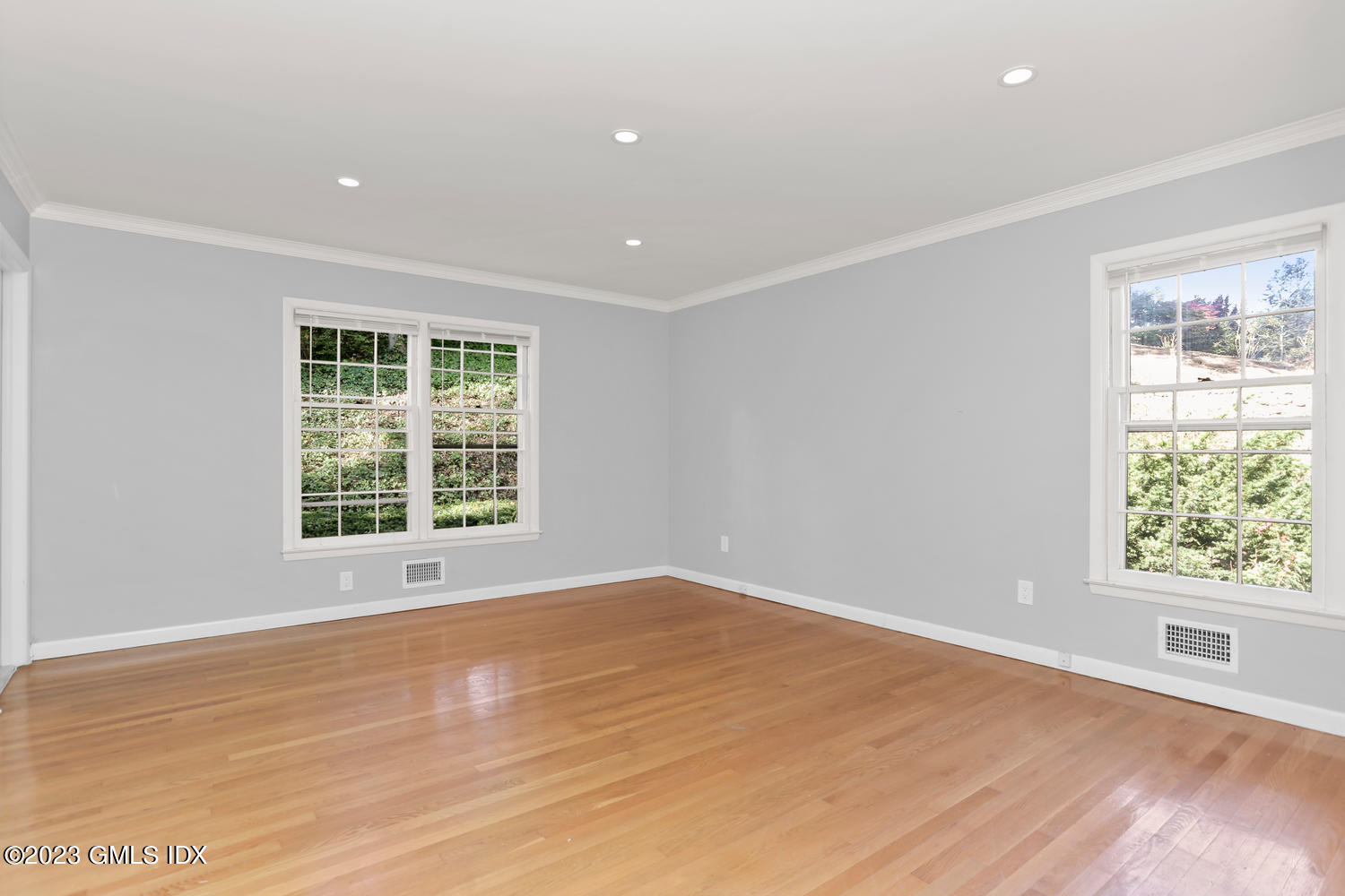 6 Pintail Lane Greenwich, CT 06830 - Photo 20 of 41 a view of an empty room with wooden floor and a window