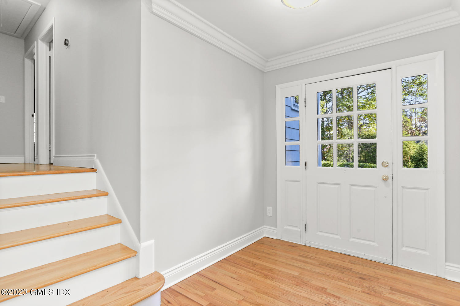 6 Pintail Lane Greenwich, CT 06830 - Photo 3 of 41 a view of an empty room with wooden floor and a window