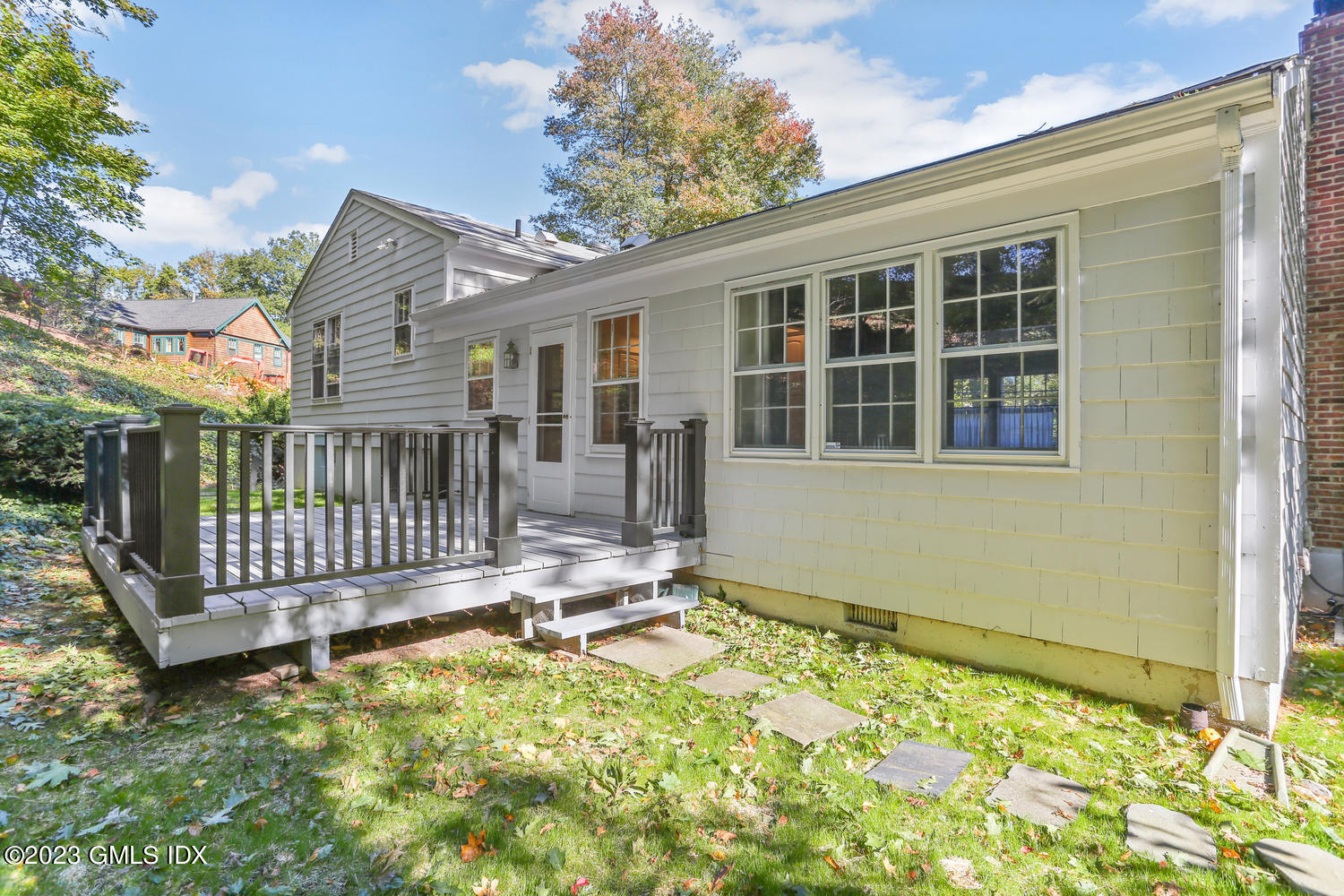 6 Pintail Lane Greenwich, CT 06830 - Photo 33 of 41 a front view of a house with a garden