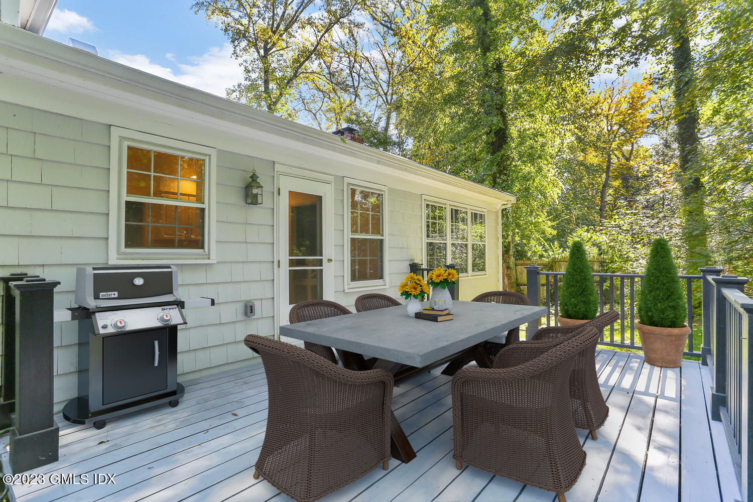 6 Pintail Lane Greenwich, CT 06830 - Photo 35 of 41 a view of a patio with table and chairs