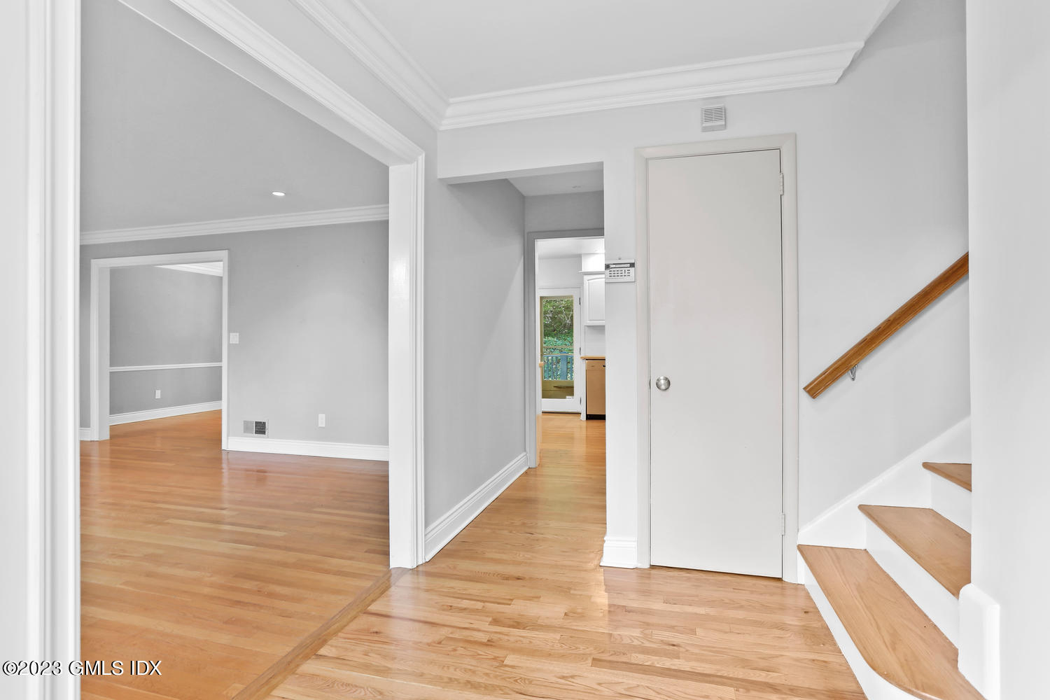 6 Pintail Lane Greenwich, CT 06830 - Photo 4 of 41 a view of a hallway with wooden floor and staircase