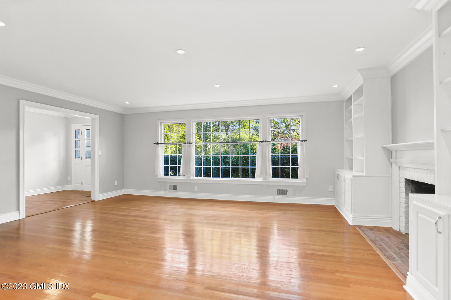 6 Pintail Lane Greenwich, CT 06830 - Photo 6 of 41 a view of an empty room with wooden floor and a window