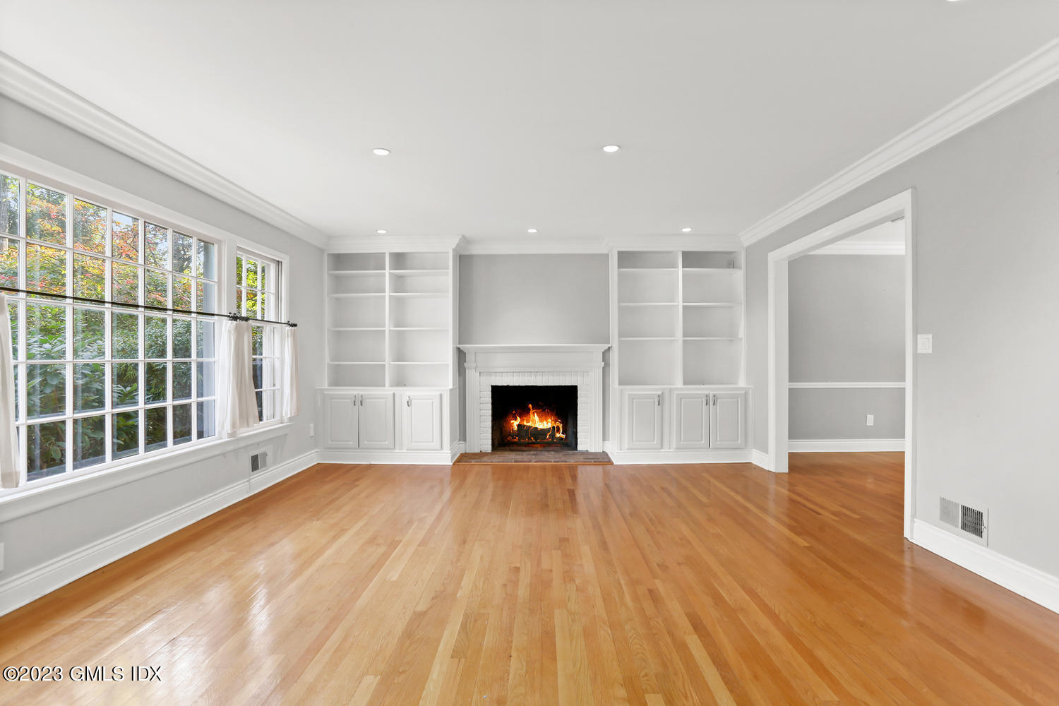 6 Pintail Lane Greenwich, CT 06830 - Photo 9 of 41 a view of an empty room with a window and fireplace