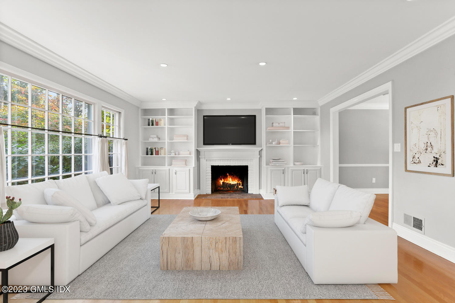 6 Pintail Lane Greenwich, CT 06830 - Photo 10 of 41 a living room with furniture a flat screen tv and a fireplace