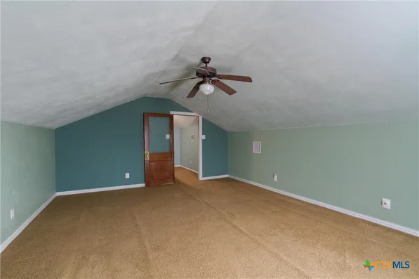 a view of room with ceiling fan