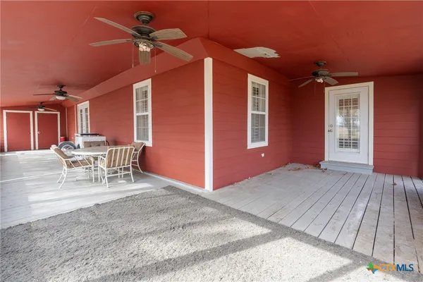 a view of wooden floor and windows on the balcony