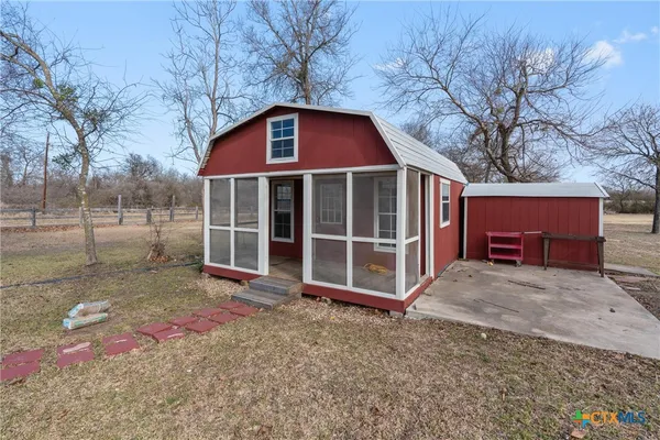 a view of a yard with a house