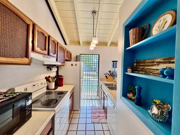 a kitchen with stainless steel appliances granite countertop a stove and a sink