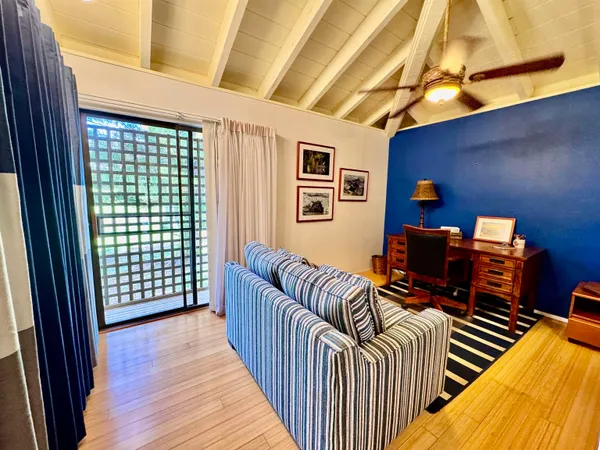 a balcony of a house with wooden floor outdoor seating