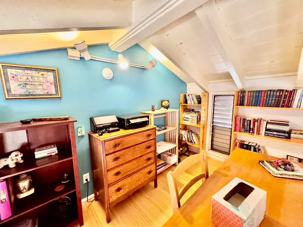 a bed room with a bed and a tv