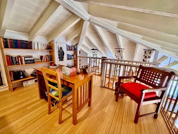 a dining room with furniture and wooden floor
