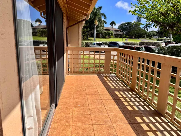 a view of balcony with wooden floor and outdoor seating