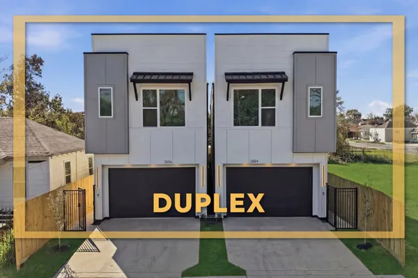 a front view of a house with large windows