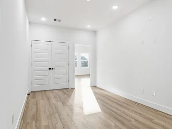 a bedroom with bed and window