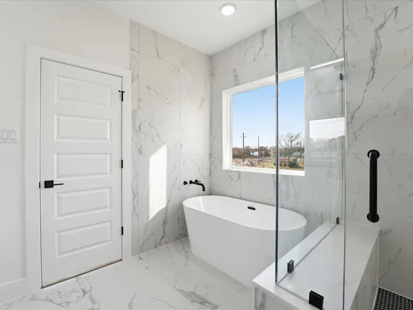 a bathroom with a double vanity sink a mirror and shower