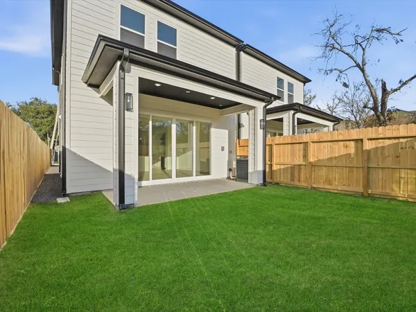 a bathroom with a granite countertop sink toilet and mirror