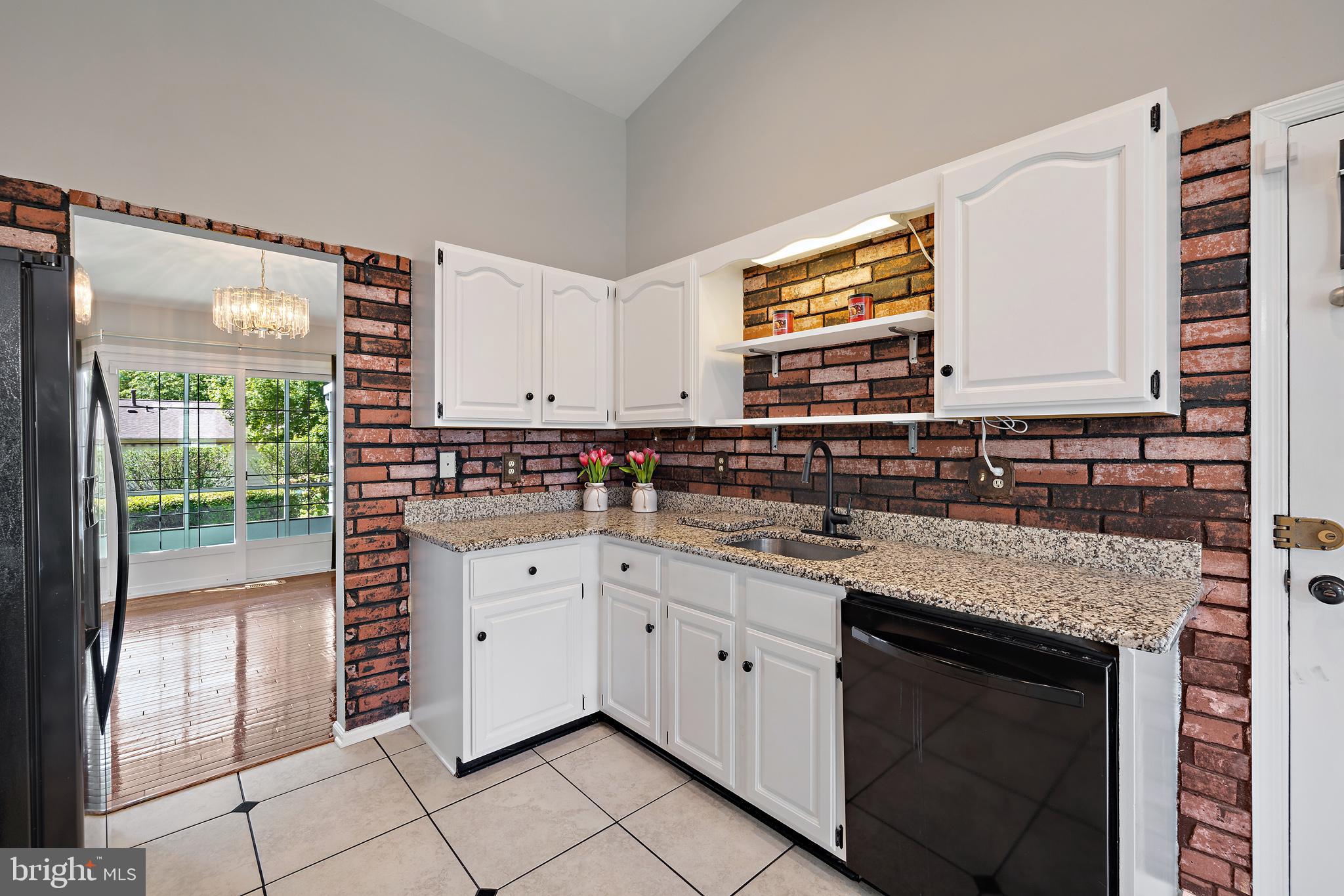 4906 Ten Mills Road Columbia, MD 21044 - Photo 13 of 54 Granite counter tops and fresh white cabinets